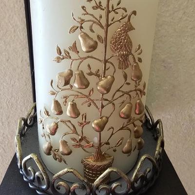 Decorative metal pillar candle holder with candle