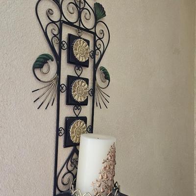 Decorative metal pillar candle holder with candle