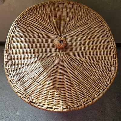 Wicker laundry hamper with wooden clothes hangers