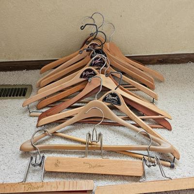 Wicker laundry hamper with wooden clothes hangers