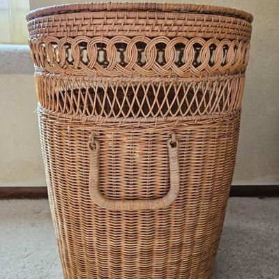 Wicker laundry hamper with wooden clothes hangers