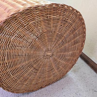 Wicker laundry hamper with wooden clothes hangers