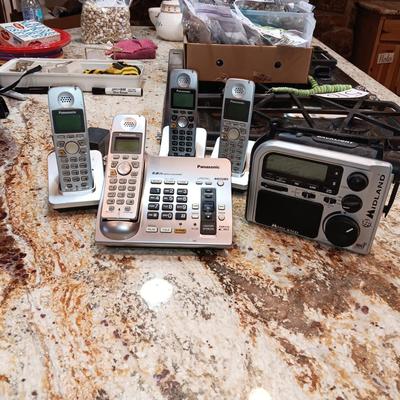 PANASONIC 4 HANDSET CORDLESS PHONES AND MIDLAND ELECTRIC OR HAND CRANK RADIO