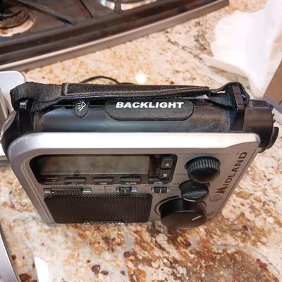PANASONIC 4 HANDSET CORDLESS PHONES AND MIDLAND ELECTRIC OR HAND CRANK RADIO