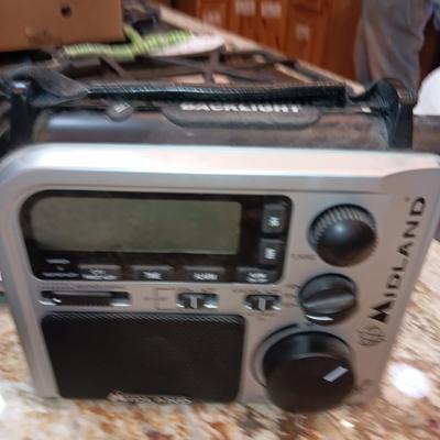 PANASONIC 4 HANDSET CORDLESS PHONES AND MIDLAND ELECTRIC OR HAND CRANK RADIO