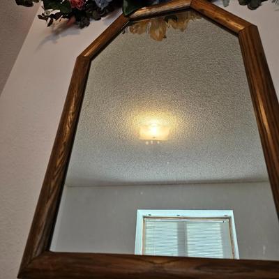 Wall mirror with dried floral decor