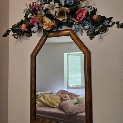 Wall mirror with dried floral decor