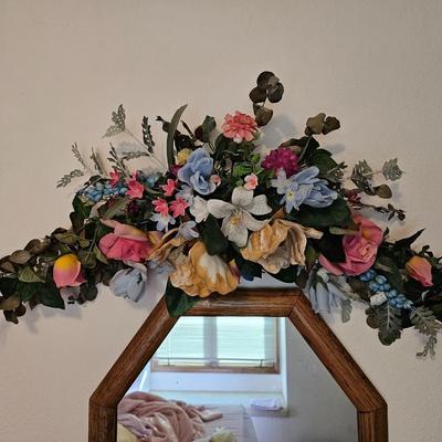 Wall mirror with dried floral decor