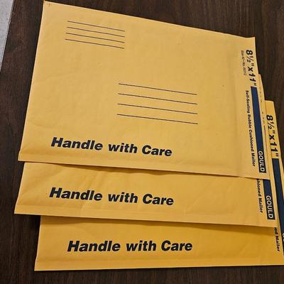 Office supplies - shipping envelopes - clip board - hole punch - and more