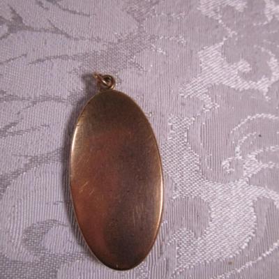 Vintage gold-tone locket with etched flowers