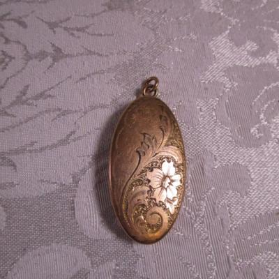 Vintage gold-tone locket with etched flowers