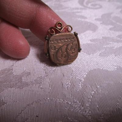 Vintage locket pendant by SKM Co. gold-tone