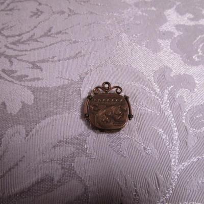 Vintage locket pendant by SKM Co. gold-tone
