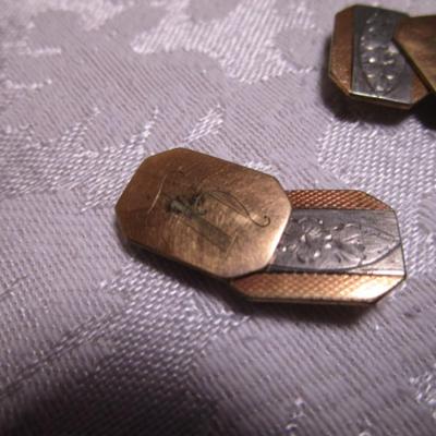 Gold-colored cufflinks