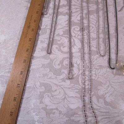 7 ID chains, 2 tassels, pins, cross, key chains