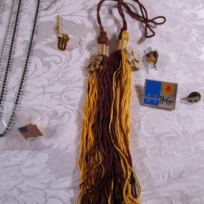 7 ID chains, 2 tassels, pins, cross, key chains
