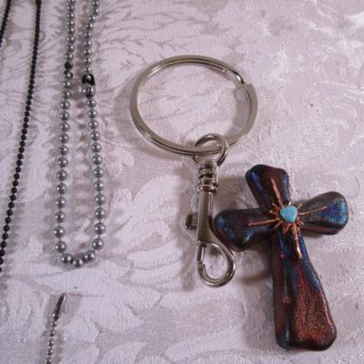 7 ID chains, 2 tassels, pins, cross, key chains