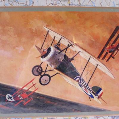 3 airplanes having dog fights picture