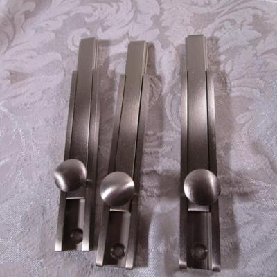 Various sizes of screws and 3 window latches with screws