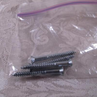 Various sizes of screws and 3 window latches with screws