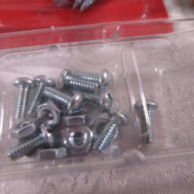 Various sizes of screws and 3 window latches with screws