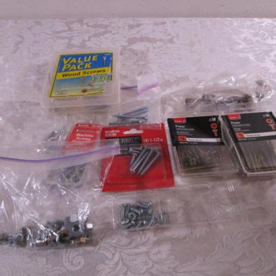 Various sizes of screws and 3 window latches with screws