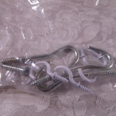Various sizes of screws and 3 window latches with screws