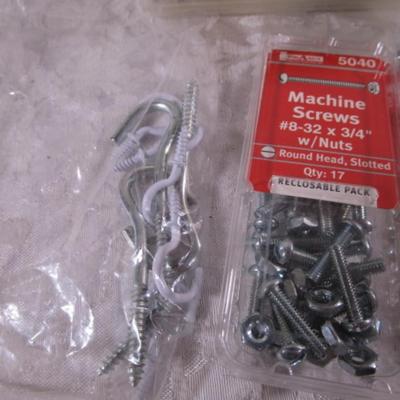 Various sizes of screws and 3 window latches with screws