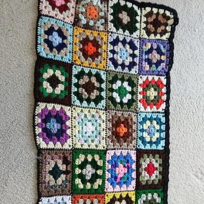 Vintage wicker seat dining room chair and an Afghan shawl