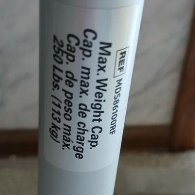 Medical assist shower chair and a toilet safety frame rail both with adjustable legs