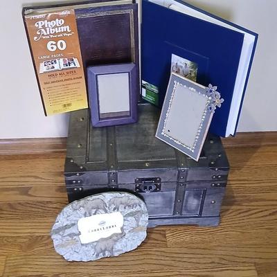 Wooden storage box with photo albums and picture frames