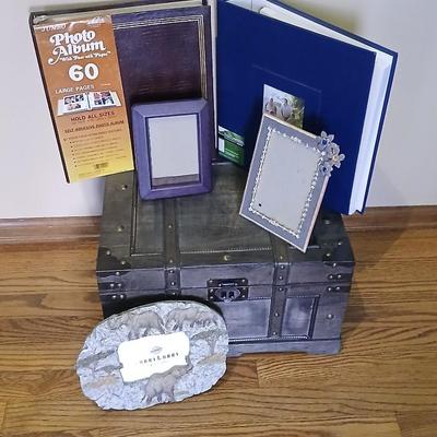 Wooden storage box with photo albums and picture frames