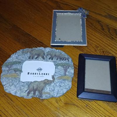 Wooden storage box with photo albums and picture frames