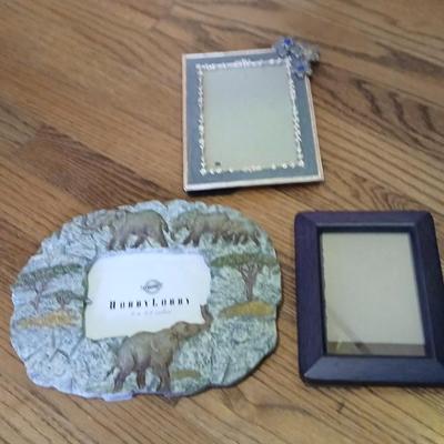 Wooden storage box with photo albums and picture frames