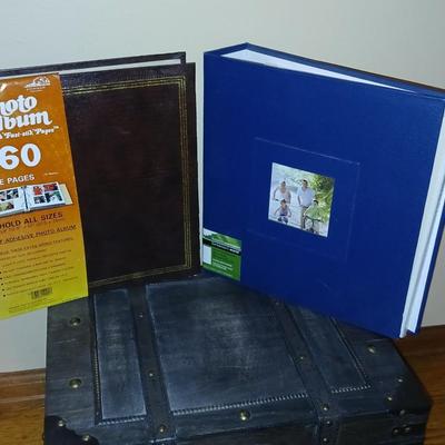 Wooden storage box with photo albums and picture frames