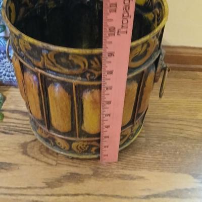 Metal wall art with a metal trash can