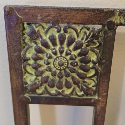 Metal wall art with a metal trash can