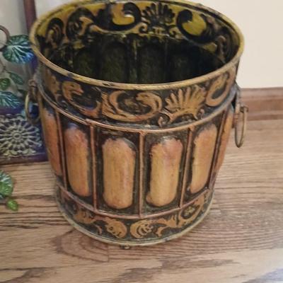 Metal wall art with a metal trash can