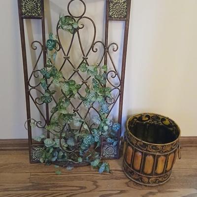 Metal wall art with a metal trash can