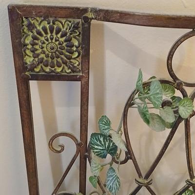 Metal wall art with a metal trash can