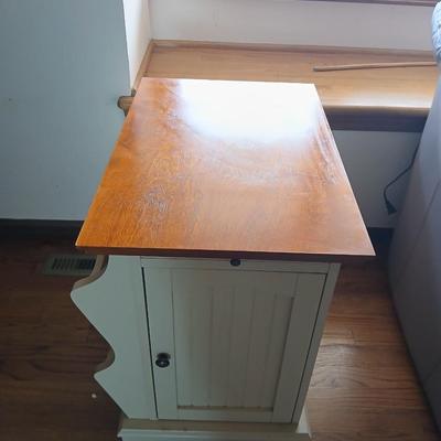 Powell end table with thru door and magazine rack on the side also has pull out extension
