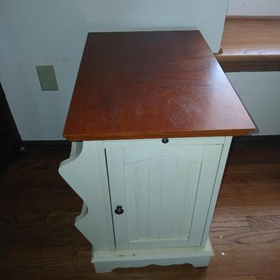 Powell end table with thru door and magazine rack on the side also has pull out extension