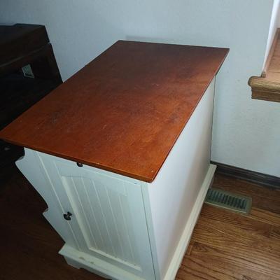 Powell end table with thru door and magazine rack on the side also has pull out extension