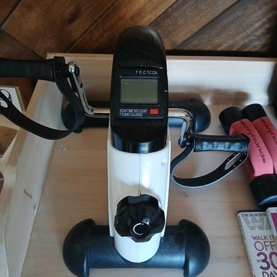 Exercise equipment, stretch bands, hand weights, DVD's and a portable pedal bike