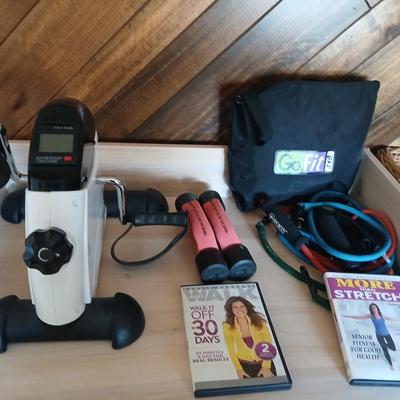 Exercise equipment, stretch bands, hand weights, DVD's and a portable pedal bike