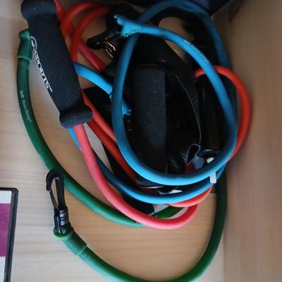 Exercise equipment, stretch bands, hand weights, DVD's and a portable pedal bike