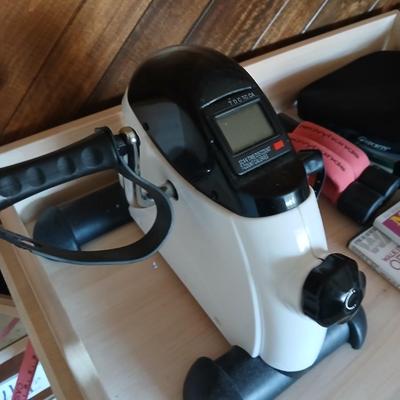 Exercise equipment, stretch bands, hand weights, DVD's and a portable pedal bike