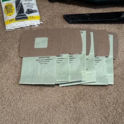 ORECK VACUUM WITH SHOULDER STRAP, EXTRA BAGS, WASTE BASKET
