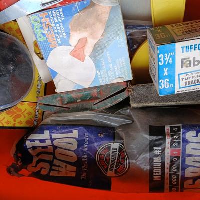 Painting supplies, rollers, brushes, with an assortment of tools to help you paint