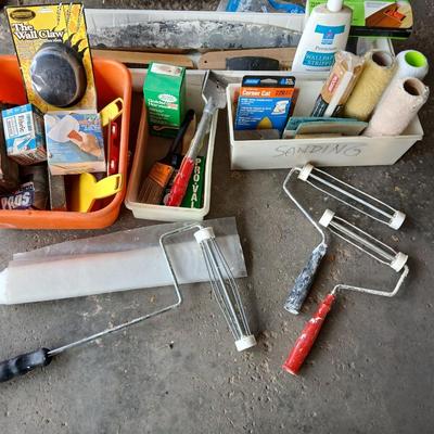 Painting supplies, rollers, brushes, with an assortment of tools to help you paint